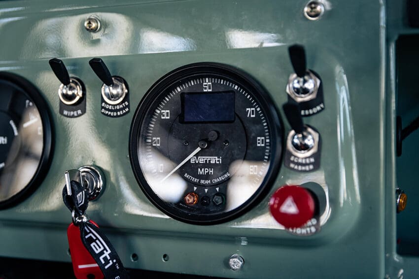 Up front, it is more of a ‘nuts and bolts’ vibe, with a cold metal dash which features all the original gauges and dials, which have been upgraded for range and charging
